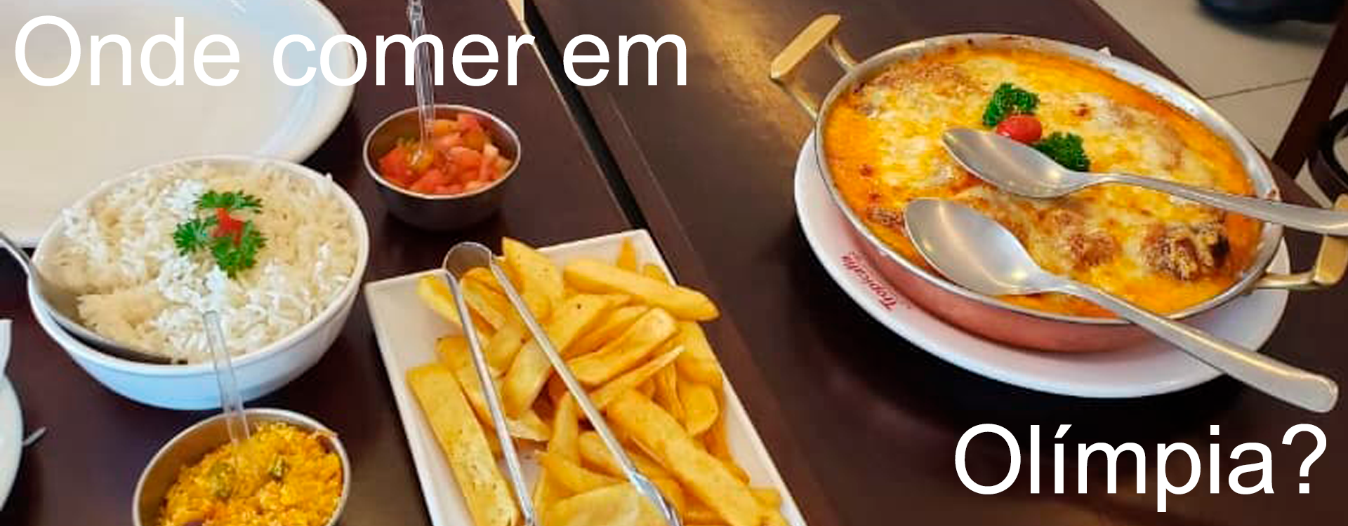 Pratos de comida sobre a mesa de quem já sabe onde comer em Olímpia e levou a família toda